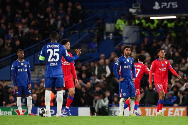 Chelsea's players react after Paris Saint-Germain's scored a third goal during the UEFA Champions League round of 16 second leg football match between Chelsea FC and Paris Saint-Germain (PSG) at Stamford Bridge, west London on March 17, 2026. (Photo by FRANCK FIFE / AFP)
