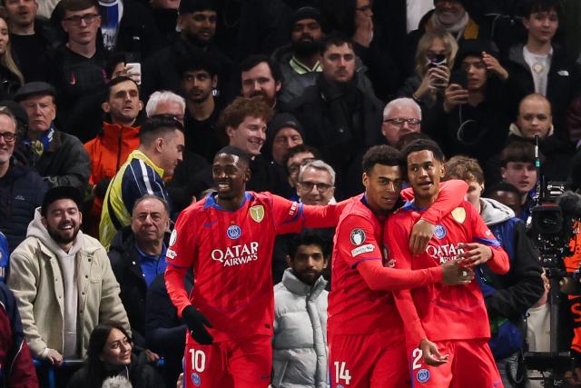 Paris Saint-Germain's French midfielder #24 Senny Mayulu (R) celebrates with teammates after scoring his team third goal during the UEFA Champions League round of 16 second leg football match between Chelsea FC and Paris Saint-Germain (PSG) at Stamford Bridge, west London on March 17, 2026. (Photo by FRANCK FIFE / AFP)