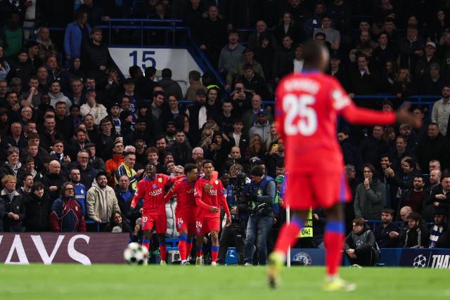 Paris Saint-Germain's French midfielder #24 Senny Mayulu (C-R) celebrates with teammates after scoring his team third goal during the UEFA Champions League round of 16 second leg football match between Chelsea FC and Paris Saint-Germain (PSG) at Stamford Bridge, west London on March 17, 2026. (Photo by FRANCK FIFE / AFP)