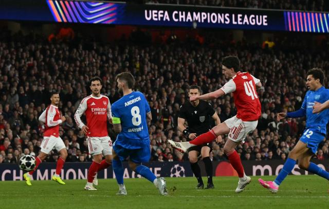 Arsenal's English midfielder #41 Declan Rice scores the team's second goal during the UEFA Champions League, last 16 second leg football match between Arsenal and Bayer Leverkusen at the Emirates Stadium in north London on March 17, 2026. (Photo by Glyn KIRK / AFP)