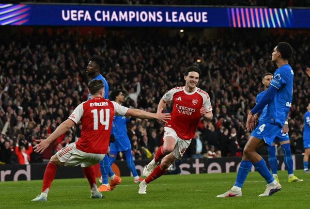 Arsenal's English midfielder #41 Declan Rice celebrates scoring the team's second goal during the UEFA Champions League, last 16 second leg football match between Arsenal and Bayer Leverkusen at the Emirates Stadium in north London on March 17, 2026. (Photo by Glyn KIRK / AFP)