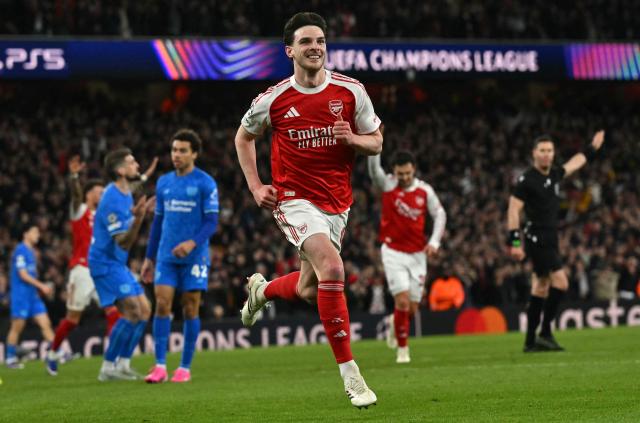 Arsenal's English midfielder #41 Declan Rice celebrates scoring the team's second goal during the UEFA Champions League, last 16 second leg football match between Arsenal and Bayer Leverkusen at the Emirates Stadium in north London on March 17, 2026. (Photo by Glyn KIRK / AFP)
