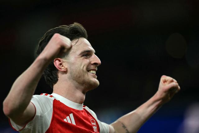 Arsenal's English midfielder #41 Declan Rice celebrates scoring the team's second goal during the UEFA Champions League, last 16 second leg football match between Arsenal and Bayer Leverkusen at the Emirates Stadium in north London on March 17, 2026. (Photo by Glyn KIRK / AFP)