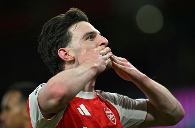 Arsenal's English midfielder #41 Declan Rice celebrates scoring the team's second goal during the UEFA Champions League, last 16 second leg football match between Arsenal and Bayer Leverkusen at the Emirates Stadium in north London on March 17, 2026. (Photo by Glyn KIRK / AFP)