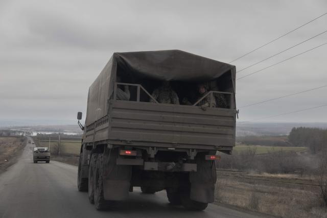Ukrainian servicemen drive in a military truck on a road in the Kharkiv region on March 17, 2026, amid the Russian invasion of Ukraine. (Photo by Roman PILIPEY / AFP)
