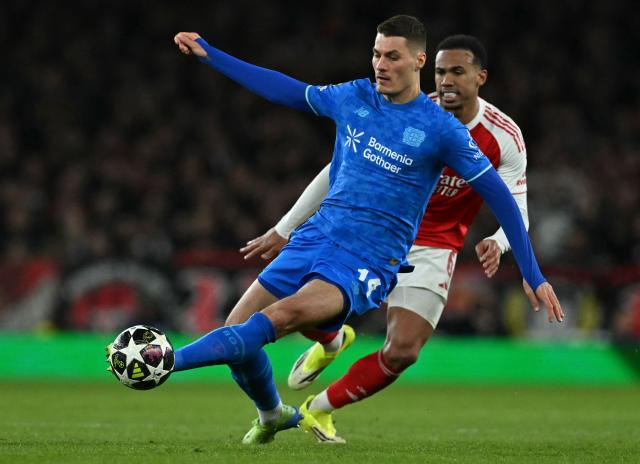 Bayer Leverkusen's Czech forward #14 Patrik Schick defends from Arsenal's Brazilian defender #06 Gabriel Magalhaes during the UEFA Champions League, last 16 second leg football match between Arsenal and Bayer Leverkusen at the Emirates Stadium in north London on March 17, 2026. (Photo by Glyn KIRK / AFP)