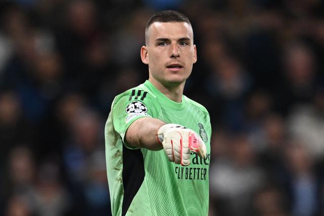 Real Madrid's Ukrainian goalkeeper #13 Andriy Lunin gestures during the UEFA Champions League, round of 16 second leg football match between Manchester City and Real Madrid at the Etihad Stadium in Manchester, north west England, on March 17, 2026. (Photo by Paul ELLIS / AFP)