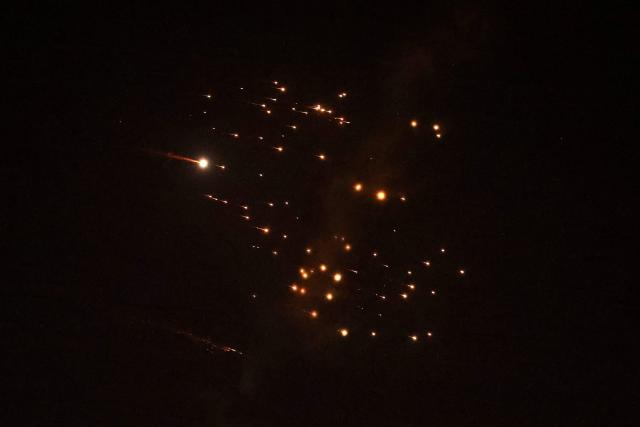 Rocket trails are seen in the sky amid a fresh barrage of Iranian missile attacks above the Israeli coastal city of Netanya on March 18, 2026. (Photo by JACK GUEZ / AFP) / 