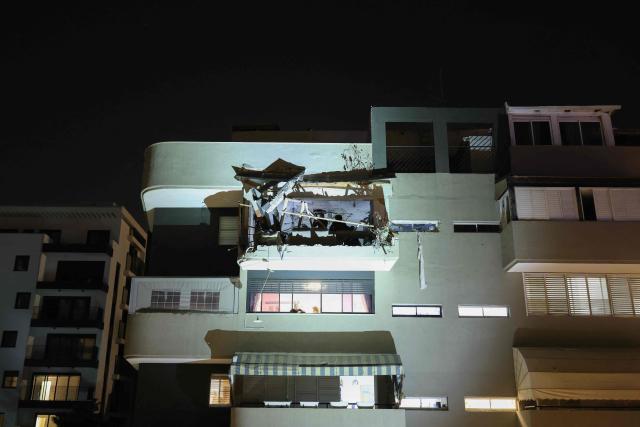 An apartment damaged by a missile strike is seen in Ramat Gan, in the outskirts of Tel-Aviv, Israel on March 18, 2026. (Photo by Ilia YEFIMOVICH / AFP)