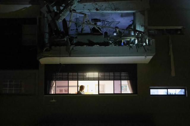 An apartment damaged by a missile strike is seen in Ramat Gan, in the outskirts of Tel Aviv, Israel on March 18, 2026. (Photo by Ilia YEFIMOVICH / AFP) / 