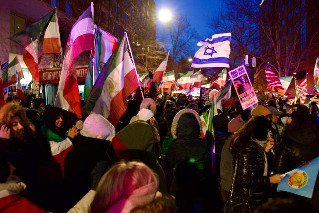 Iranian protesters gather during a demonstration organized by diaspora groups calling for political change in Iran and responding to appeals by opposition figures, outside the Iranian Interests Section in Washington, DC, on March 17, 2026, US President Donald Trump said that he does not know whether Iran's new supreme leader Mojtaba Khamenei is still alive, adding that Washington was unclear whom it could negotiate with in Tehran. (Photo by Amid FARAHI / AFP)