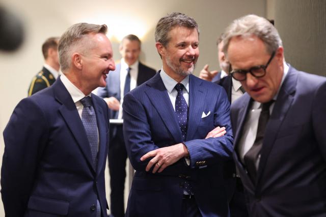 Denmark's King Frederik X (C) speaks with Australia's Minister for Climate Change and Energy Chris Bowen (L) during a Royal Business Walk with representatives from Danish companies, in Melbourne on March 18, 2026. (Photo by Jesse Thompson / POOL / AFP)