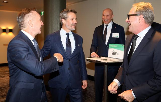 Denmark's King Frederik X (2nd-L) speaks with Australia's Minister for Climate Change and Energy Chris Bowen (L) during a Royal Business Walk with representatives from Danish companies, in Melbourne on March 18, 2026. (Photo by Jesse Thompson / POOL / AFP)