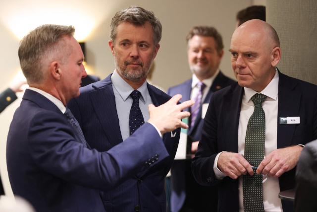 Denmark's King Frederik X (C) speaks with Australia's Minister for Climate Change and Energy Chris Bowen (L) during a Royal Business Walk with representatives from Danish companies, in Melbourne on March 18, 2026. (Photo by Jesse Thompson / POOL / AFP)