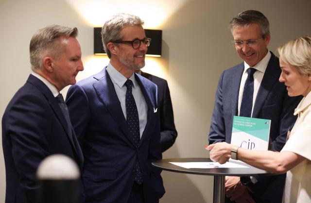 Denmark's King Frederik X (C) and Australia's Minister for Climate Change and Energy Chris Bowen (L) attend a Royal Business Walk with representatives from Danish companies, in Melbourne on March 18, 2026. (Photo by Jesse Thompson / POOL / AFP)