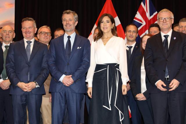 Denmark's King Federik X (2nd-L) and Queen Mary (C) pose for photos during a Royal Business Walk with representatives from Danish companies, in Melbourne on March 18, 2026. (Photo by Jesse Thompson / POOL / AFP)
