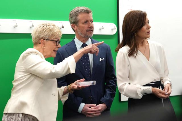 Denmark's King Frederik X (C) and Queen Mary (R) speak with Professor Kathryn North Director of Murdoch Children’s Research Institute (MCRI) (L) during a tour of the MCRI at the Royal Children’s Hospital in Melbourne on March 18, 2026. (Photo by Asanka Ratnayake / POOL / AFP)