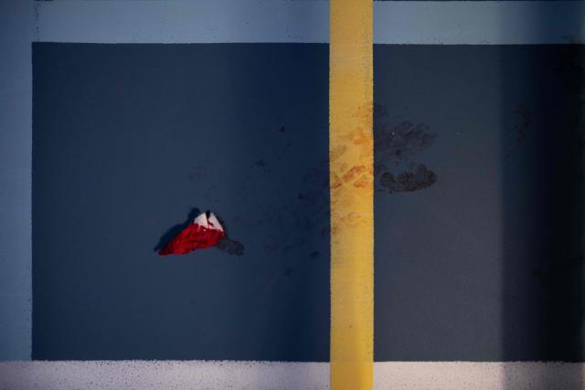 A blood-soaked tissue lies on the ground during an international boxing tournament in Nuuk, Greenland, on February 28, 2026. Greenland has one of the highest suicide rates in the world, especially among teenagers and young adults. Psychiatric care is uneven, and many youths must leave their families to study in Nuuk. In the capital, many turn to boxing as a way to channel their pain. (Photo by Florent VERGNES / AFP)