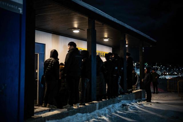 Young people from Nuuk crowd in front of the dojo in the cold night, hoping to get inside to watch the ‘Fight for Greenland’ boxing match in Nuuk, Greenland, on February 28, 2026. Greenland has one of the highest suicide rates in the world, especially among teenagers and young adults. Psychiatric care is uneven, and many youths must leave their families to study in Nuuk. In the capital, many turn to boxing as a way to channel their pain. (Photo by Florent VERGNES / AFP)