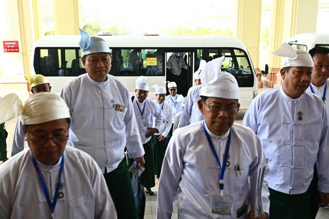 Representatives arrive to attend a session of the Amyotha Hluttaw, Upper House of Parliament of Myanmar, in Naypyidaw on March 18, 2026. (Photo by Sai Aung MAIN / AFP)