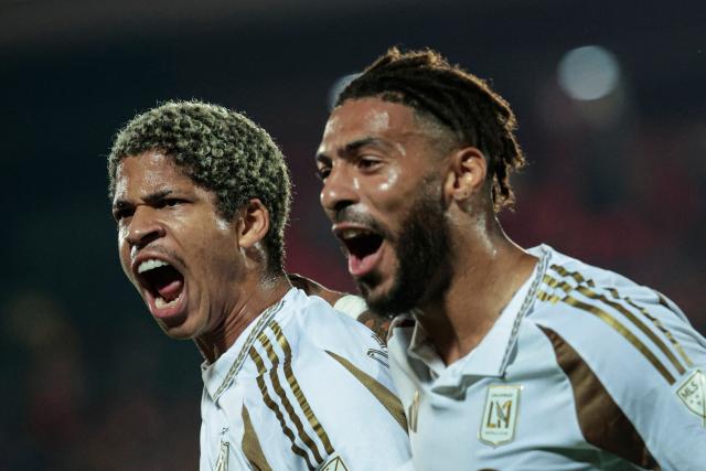 TOPSHOT - Los Angeles FC's Venezuelan forward #30 David Martinez (L) celebrates with teammate Gabonese forward #99 Denis Bouanga after scoring his team's second goal during the CONCACAF Central American Cup round of 16 second leg football match between Costa Rica's Alajuelense and US' Los Angeles FC at the Alejandro Morera Soto Stadium in Alajuela, Costa Rica on March 17, 2026. (Photo by JOHN DURAN / AFP)