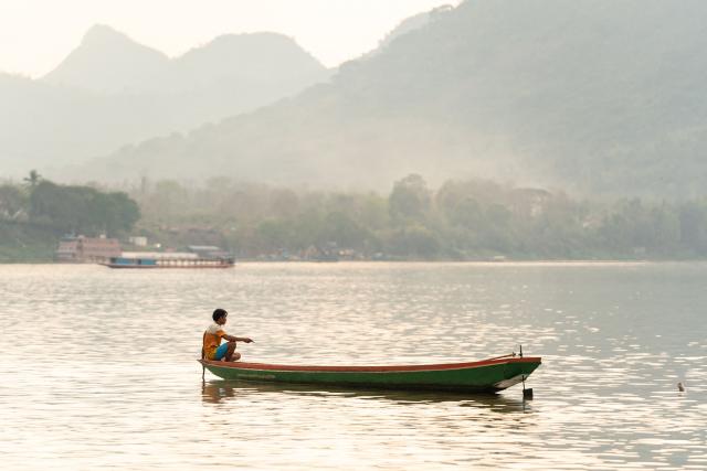 A man fishes along the Mekong river in Luang Prabang on March 16, 2026. (Photo by AFP)