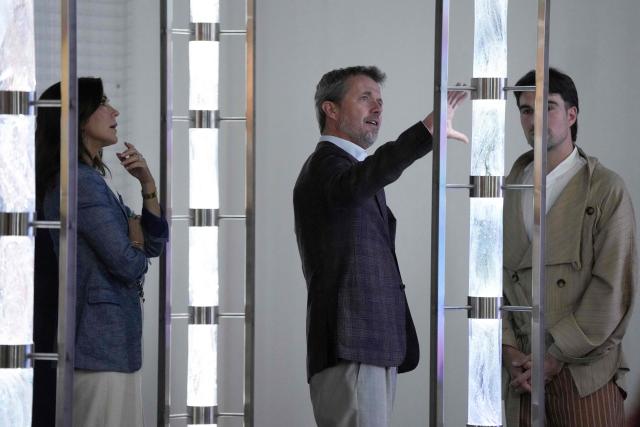 Denmark's King Frederik X (C) and Queen Mary (L) inspect the art at the official opening of an exhibition by Danish/Australian duo Ting & Bojesen in Melbourne on March 18, 2026. (Photo by Asanka Ratnayake / POOL / AFP)