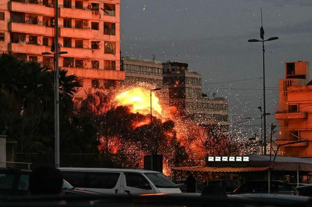 TOPSHOT - A fireball rises from the site of an Israeli airstrike that targeted a building in Beirut’s Bashoura neighbourhood on March 18, 2026. Lebanon was drawn into the Middle East war on March 2 when Iran-backed militant group Hezbollah launched rockets towards Israel in response to US-Israeli strikes that killed Iranian supreme leader Ayatollah Ali Khamenei. (Photo by FADEL itani / AFP)