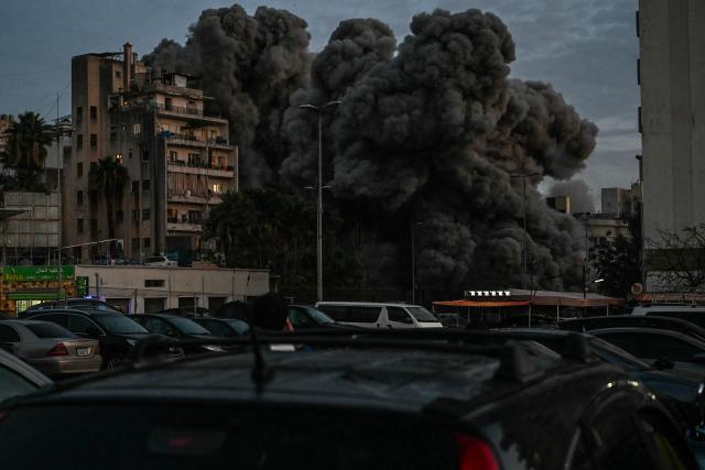 Smoke engulfs a building hit by an Israeli airstrike in Beirut’s Bashoura neighbourhood early on March 18, 2026. Lebanon was drawn into the Middle East war on March 2 when Iran-backed militant group Hezbollah launched rockets towards Israel in response to US-Israeli strikes that killed Iranian supreme leader Ayatollah Ali Khamenei. (Photo by FADEL itani / AFP)