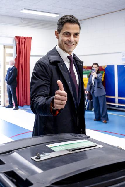Netherlands' Prime Minister Rob Jetten gives a thumbs up after casting his vote for the municipal elections at the OBS Archipel in The Hague on March 18, 2026. (Photo by Sem van der Wal / ANP / AFP) / Netherlands OUT