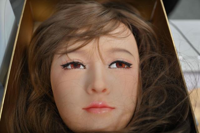 A humanoid robotic head that mimics human expressions from Shenzhen Xiaoquan Technology is displayed during the International AI Application and Robotics Innovation Exhibition in Beijing on March 18, 2026. (Photo by ADEK BERRY / AFP)