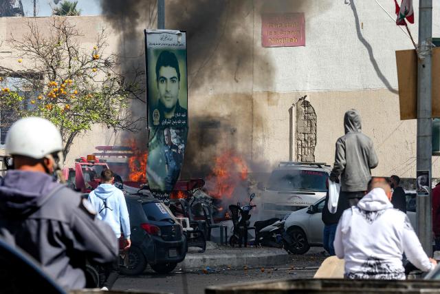 A vehicle that was targeted by Israeli bombardment burns in Lebanon's southern coastal city of Sidon on March 18, 2026. Lebanon was drawn into the Middle East war on March 2 when pro-Iran Hezbollah launched rockets towards Israel in response to US-Israeli strikes that killed Iran's supreme leader. (Photo by MAHMOUD ZAYYAT / AFP)