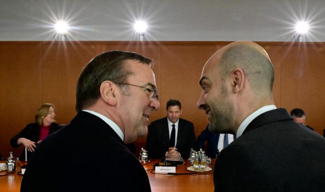 French Foreign Minister Jean-Noel Barrot (R) talks with German Defence Minister Boris Pistorius as they attend the weekly meeting of the German government's cabinet, on March 18, 2026 at the Chancellery in Berlin. (Photo by Tobias SCHWARZ / AFP)