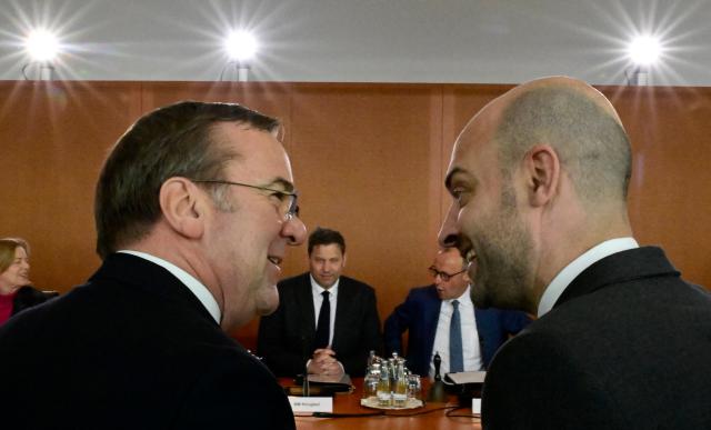 French Foreign Minister Jean-Noel Barrot (R) talks with German Defence Minister Boris Pistorius as they attend the weekly meeting of the German government's cabinet, on March 18, 2026 at the Chancellery in Berlin. (Photo by Tobias SCHWARZ / AFP)
