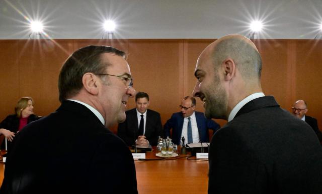 French Foreign Minister Jean-Noel Barrot (R) talks with German Defence Minister Boris Pistorius as they attend the weekly meeting of the German government's cabinet, on March 18, 2026 at the Chancellery in Berlin. (Photo by Tobias SCHWARZ / AFP)