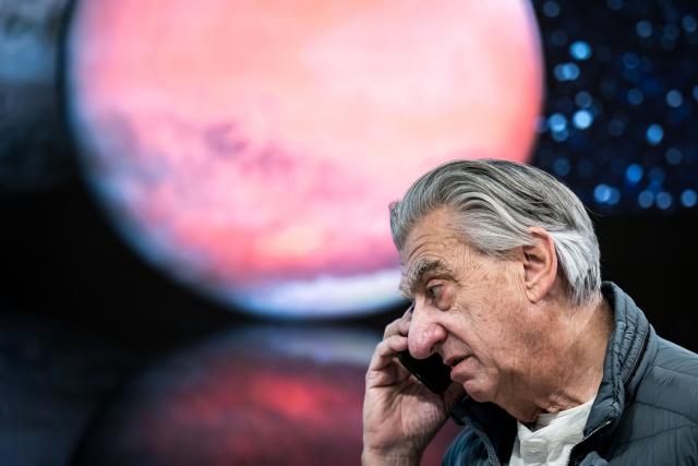 Swiss watchmaker Swatch Group CEO Nick Hayek speaks on his mobile ahead of a press conference to present the group's annual results in Biel on March 18, 2026. Swatch reported a plunge in net profit last year on weak demand for movements and other components, though it forecast a strong recovery in 2026. (Photo by Fabrice COFFRINI / AFP)