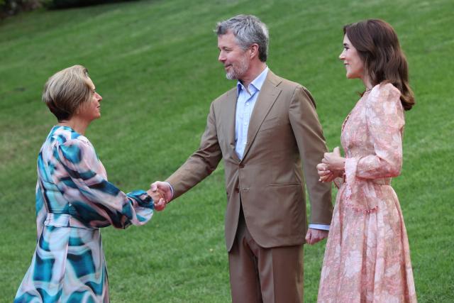 Denmark's King Frederik X (C) and Queen Mary (R) greet Michelle Rowland, Attorney-General of Australia, during ‘An Evening in the Garden’ at the Royal Botanic Gardens in Melbourne on March 18, 2026. (Photo by Jesse Thompson / POOL / AFP)
