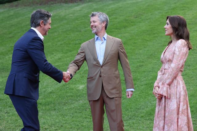 Denmark's King Frederik X (C) and Queen Mary (R) greet Nicholas Reece, Lord Mayor of Melbourne, during ‘An Evening in the Garden’ at the Royal Botanic Gardens in Melbourne on March 18, 2026. (Photo by Jesse Thompson / POOL / AFP)