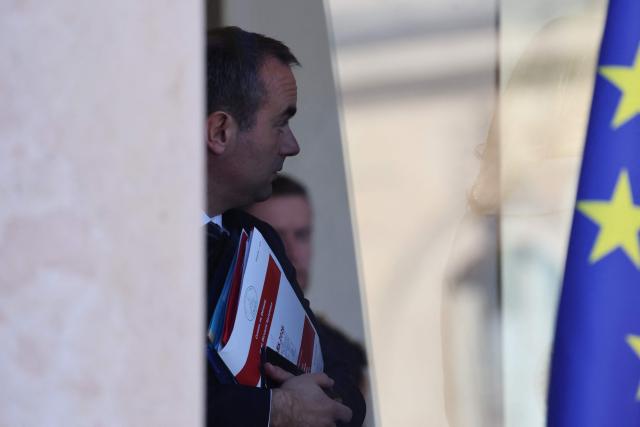 France's Prime Minister Sebastien Lecornu talks as he leaves the weekly cabinet meeting at the presidential Elysee Palace in Paris on March 18, 2026. (Photo by Ludovic MARIN / AFP)