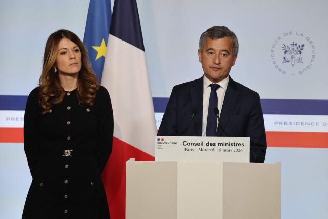 France's Government Spokesperson Maud Bregeon and France's Justice Minister Gerald Darmanin deliver a press conference following the weekly cabinet meeting at The Elysee Presidential Palace in Paris on March 18, 2026. (Photo by Ludovic MARIN / AFP)