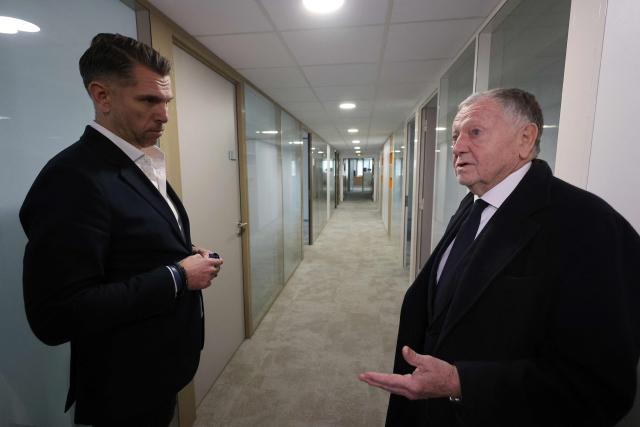 President of Business software publisher Cegid, vice-President of French football federation (FFF) and candidate for mayor in Lyon, Jean-Michel Aulas (R) visits the former offices of the French food company Lustucru, for a housing development project in Lyon, central eastern France, on March 18, 2026. (Photo by Alex MARTIN / AFP)