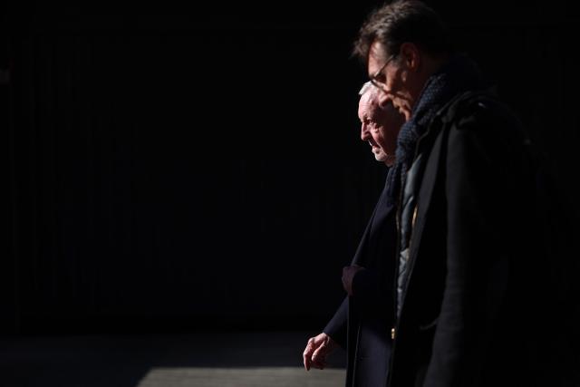 President of Business software publisher Cegid, vice-President of French football federation (FFF) and candidate for mayor in Lyon, Jean-Michel Aulas (L) leaves after a visit of the former offices of the French food company Lustucru, for a housing development project in Lyon, central eastern France, on March 18, 2026. (Photo by Alex MARTIN / AFP)