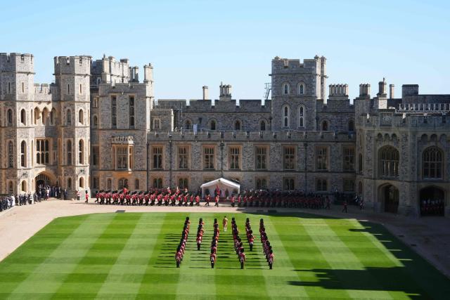 Britain's King Charles III, Britain's Queen Camilla stand with Nigeria's President Bola Tinubu and Oluremi Tinubu on the Dias during a ceremonial welcome in the Quadrangle at Windsor Castle, in Windsor, on March 18, 2026, on the first day of a two-day State Visit to the United Kingdom by Nigeria's President. (Photo by Jonathan Brady / POOL / AFP)