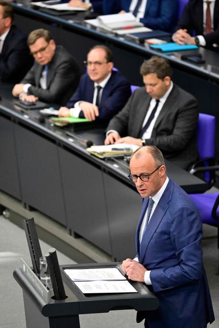 German Chancellor Friedrich Merz addresses delegates during a session at the Bundestag (lower house of parliament) in Berlin on March 18, 2026, ahead of a summut of the European Union. (Photo by John MACDOUGALL / AFP)