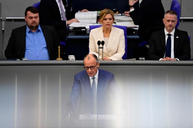 German Chancellor Friedrich Merz addresses delegates during a session at the Bundestag (lower house of parliament) in Berlin on March 18, 2026, ahead of a summit of the European Union. (Photo by John MACDOUGALL / AFP)