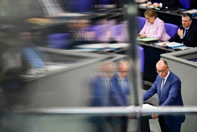 German Chancellor Friedrich Merz addresses delegates during a session at the Bundestag (lower house of parliament) in Berlin on March 18, 2026, ahead of a summit of the European Union. (Photo by John MACDOUGALL / AFP)