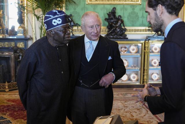 Britain's King Charles III and Nigeria's President Bola Tinubu view a special exhibition of Royal Collection items, relating to Nigeria, in the Green Drawing Room at Windsor Castle , in Windsor, on March 18, 2026, on the first day of a two-day State Visit to the United Kingdom by Nigeria's President. (Photo by Aaron Chown / POOL / AFP)