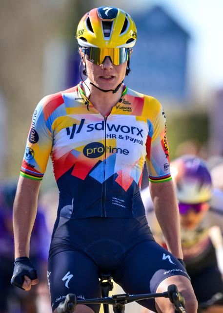 SD Worx-Protime's rider Belgian Lotte Kopecky celebrates as she crosses the finish line to win the 'Nokere Koerse' one day women cycling race, 133,3km from Deinze to Nokere, on March 18, 2026. (Photo by DAVID PINTENS / Belga / AFP) / Belgium OUT