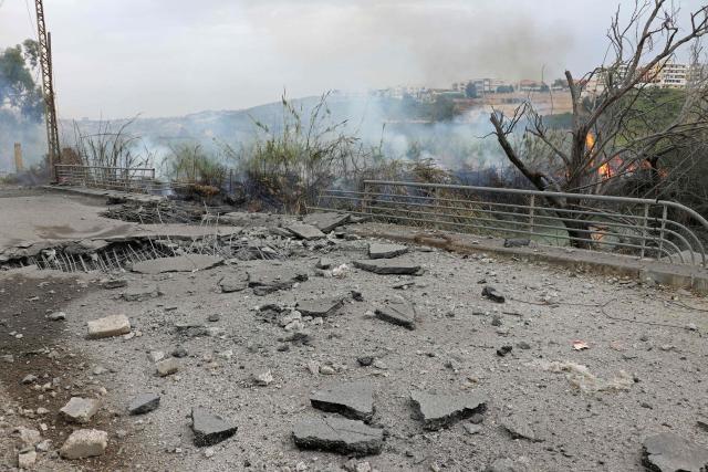 This photograph shows the destroyed Qasmiye Bridge built over the Litani River, following an Israeli airstrike, in Qasmiye on March 18, 2026. The Israeli military said it planned to strike bridges and crossings over the Litani River in southern Lebanon on March 18 to disrupt what it said were Hezbollah arms?smuggling routes. (Photo by KAWNAT HAJU / AFP)