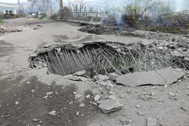 This photograph shows the destroyed Qasmiye Bridge built over the Litani River, following an Israeli airstrike, in Qasmiye on March 18, 2026. The Israeli military said it planned to strike bridges and crossings over the Litani River in southern Lebanon on March 18 to disrupt what it said were Hezbollah arms?smuggling routes. (Photo by KAWNAT HAJU / AFP)